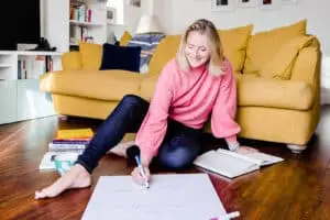 image of hazel in pink top writing